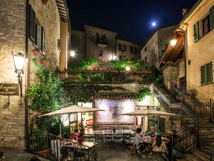 Eat outside on the terraces overlooking the village of Montone La Locanda del Capitano & Tipico Osteria Sharing Restaurant, Umbria, Italy. Chef Giancarlo Polito